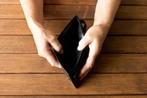 person opening an empty wallet